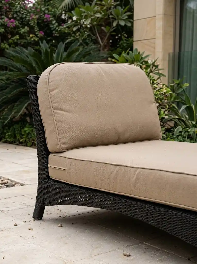 Beige upholstered outdoor lounge chair with new cushions