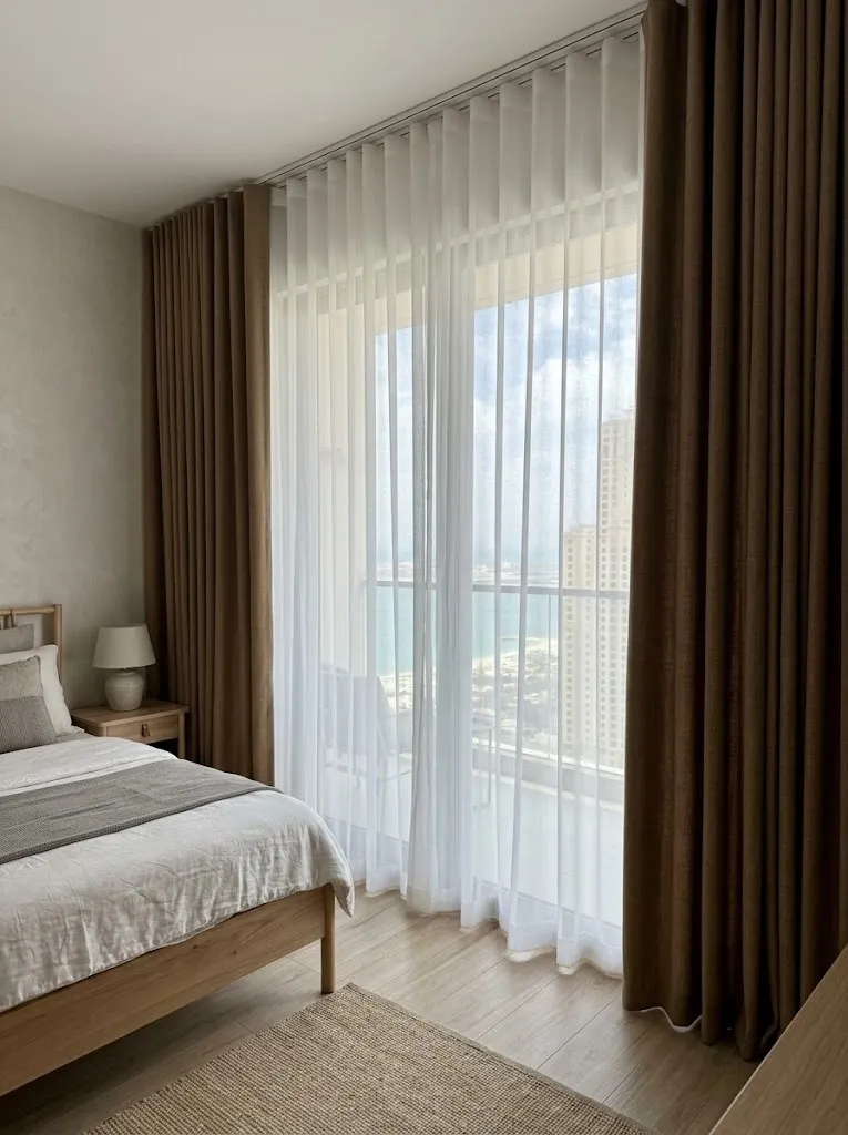 Brown blackout and white sheer bedroom curtains