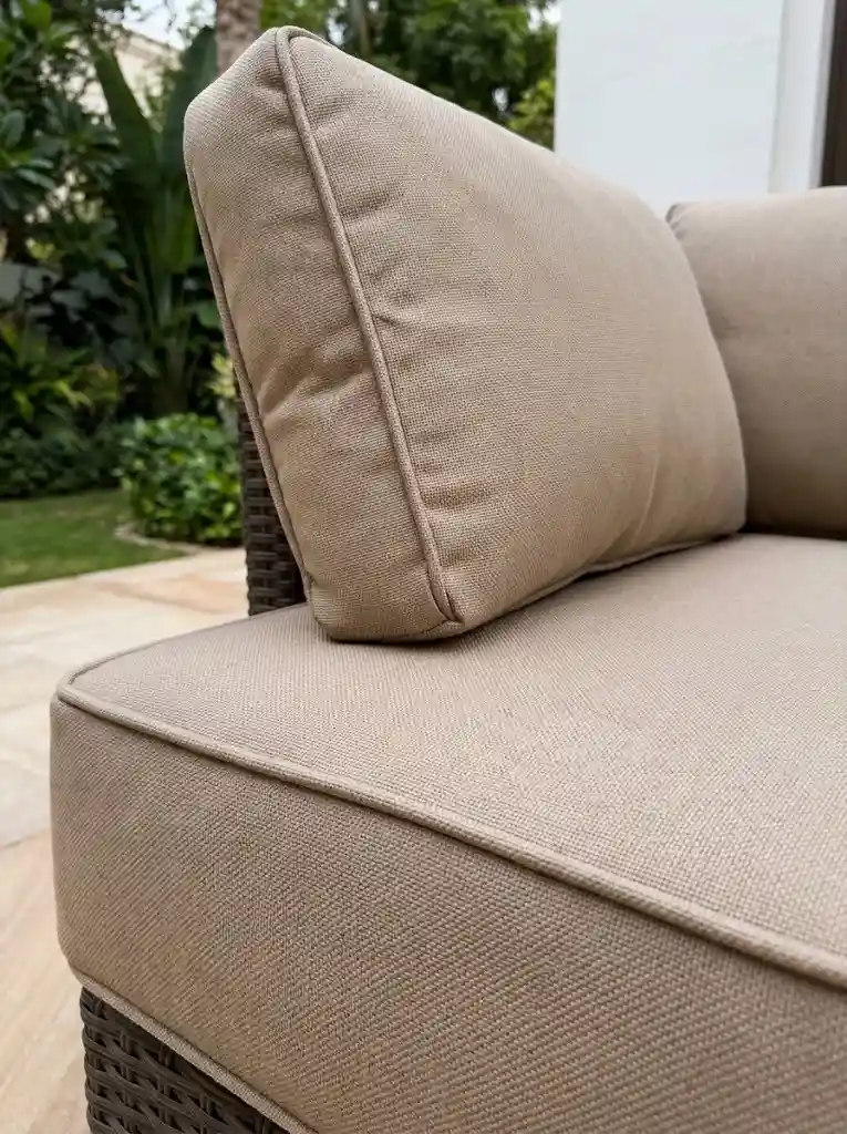 Close-up of beige outdoor upholstery stitching and piping