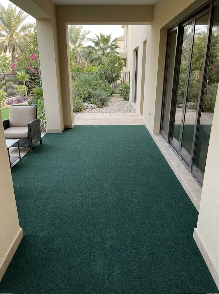 Completed dark green outdoor carpet on villa patio