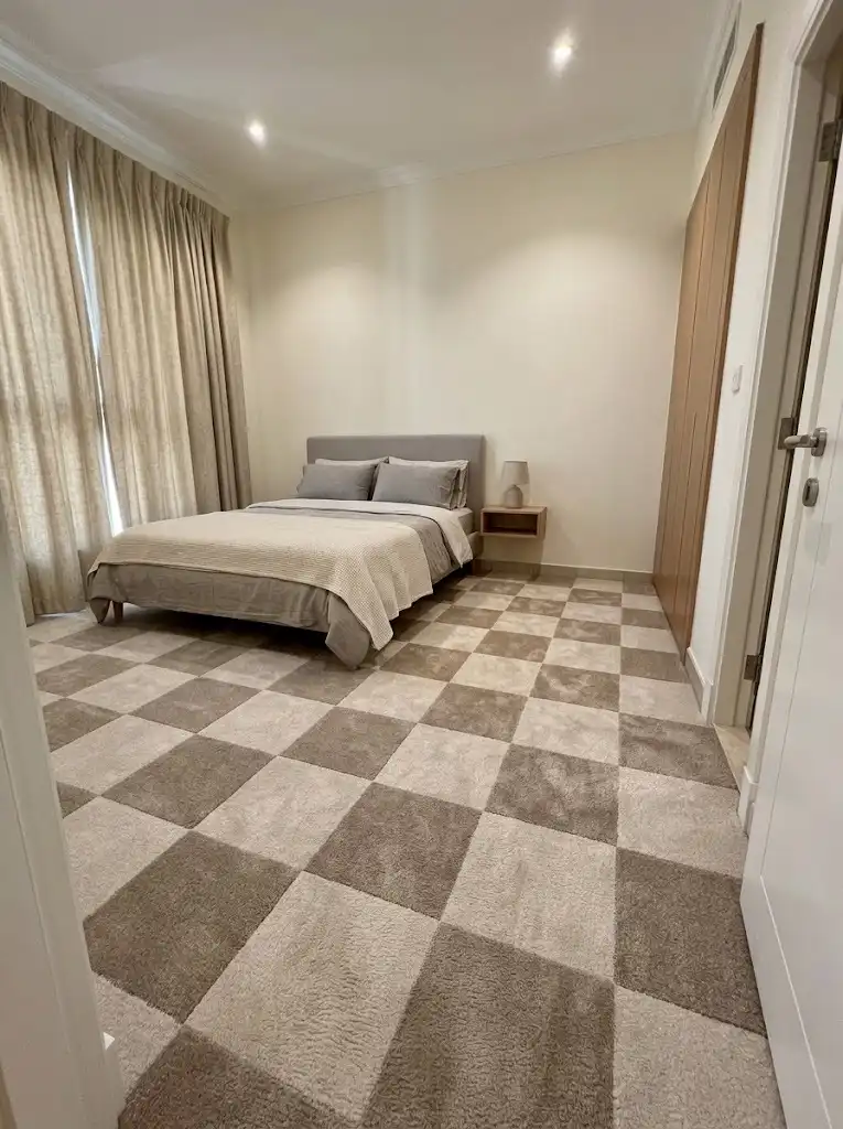 Wall-to-wall bedroom carpet installation